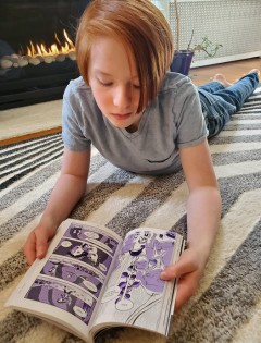 Boy reading a graphic novel